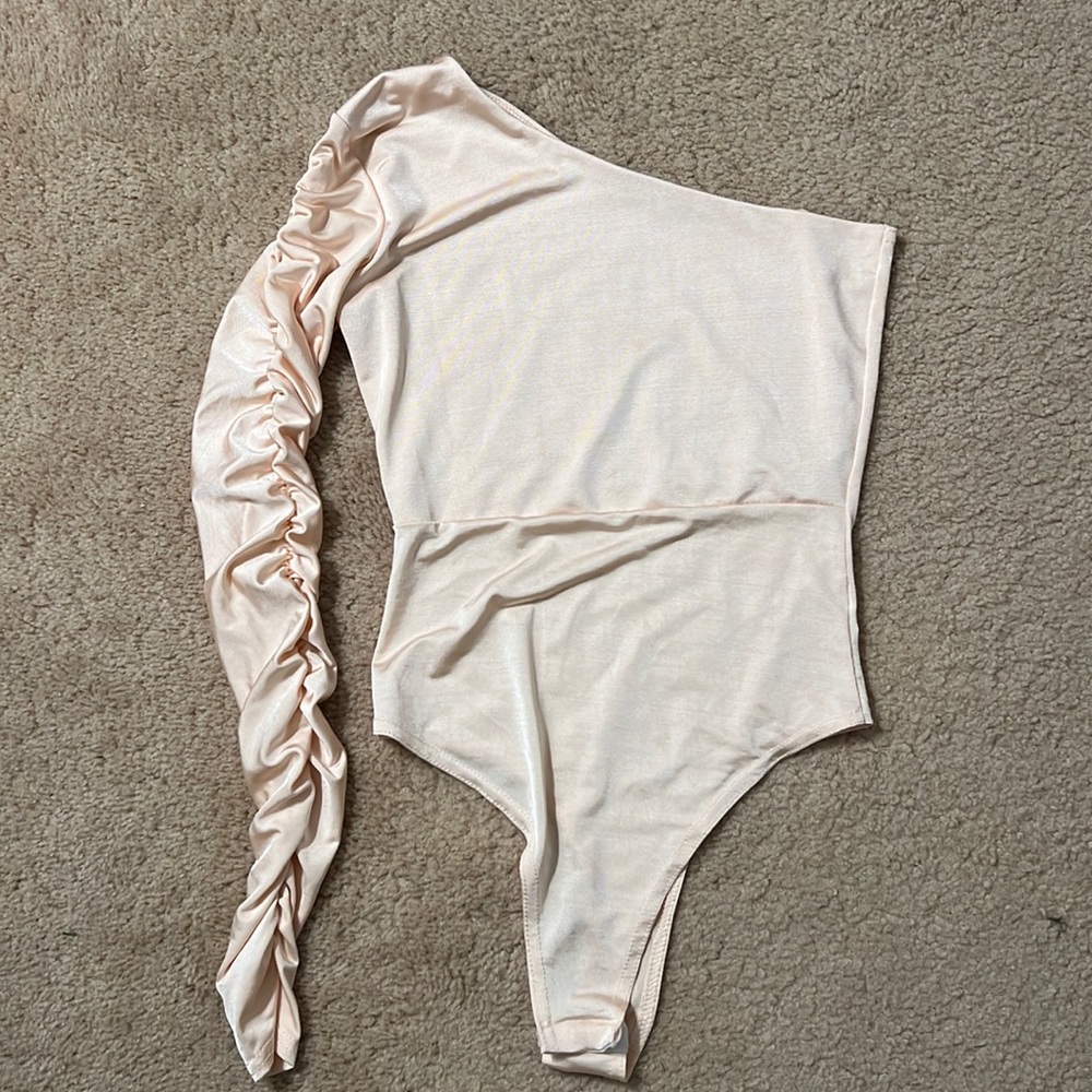 One sleeve pink body suit